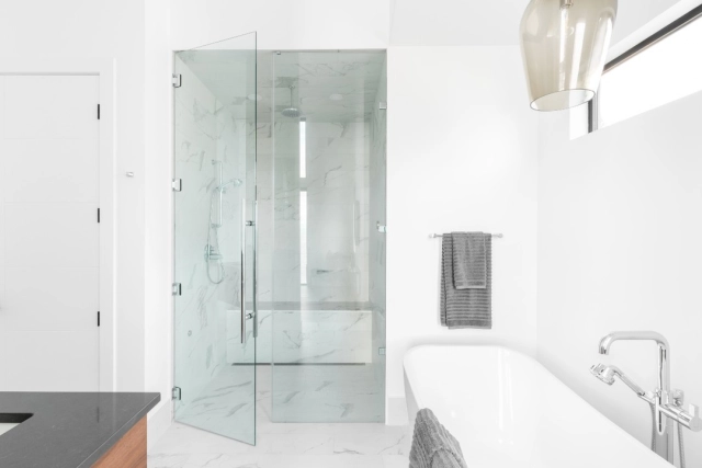 The look of this bright white bathroom creates a moment